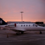 Private jet parking during sunset