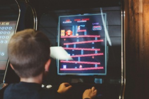Kid playing video games in a games parlour| Play area for kids in Chennai