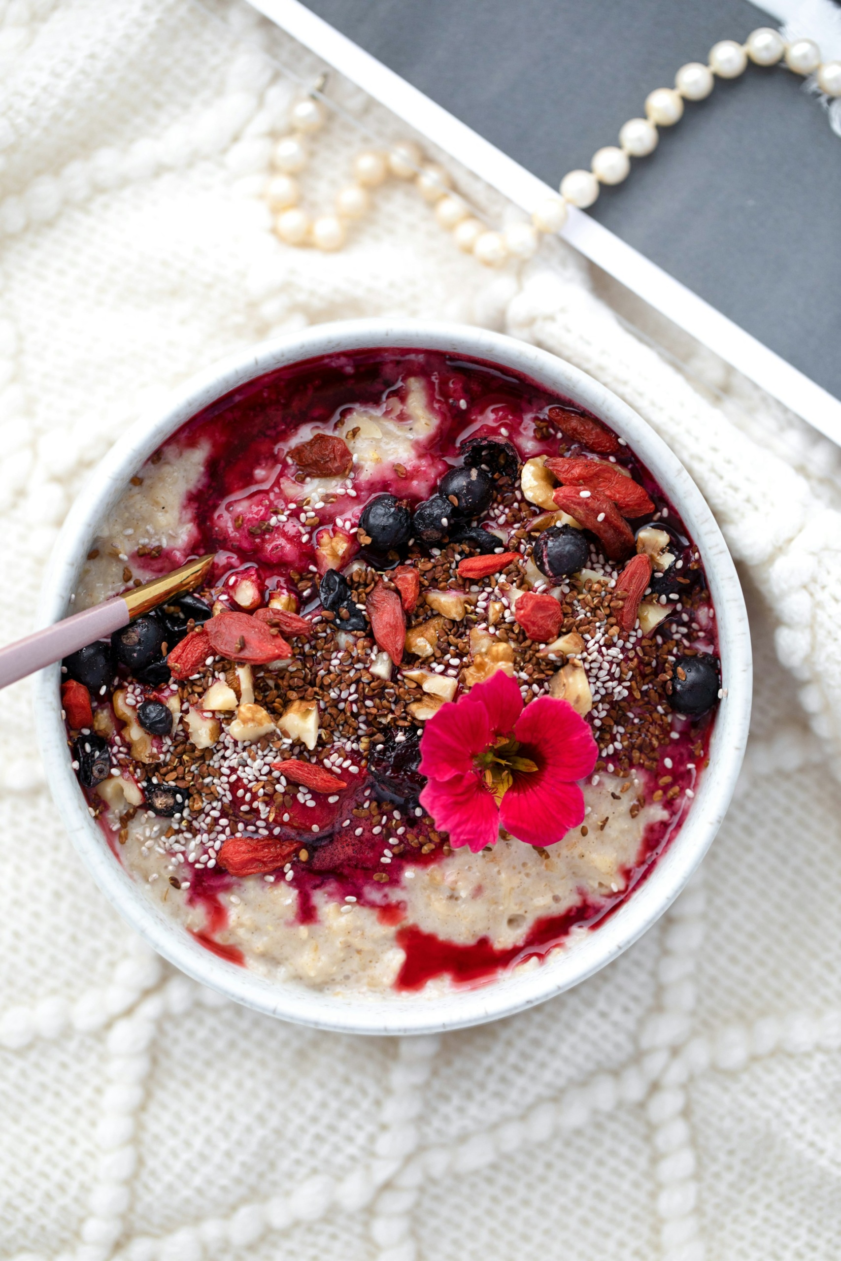 bowl of oats porridge with berry toppings